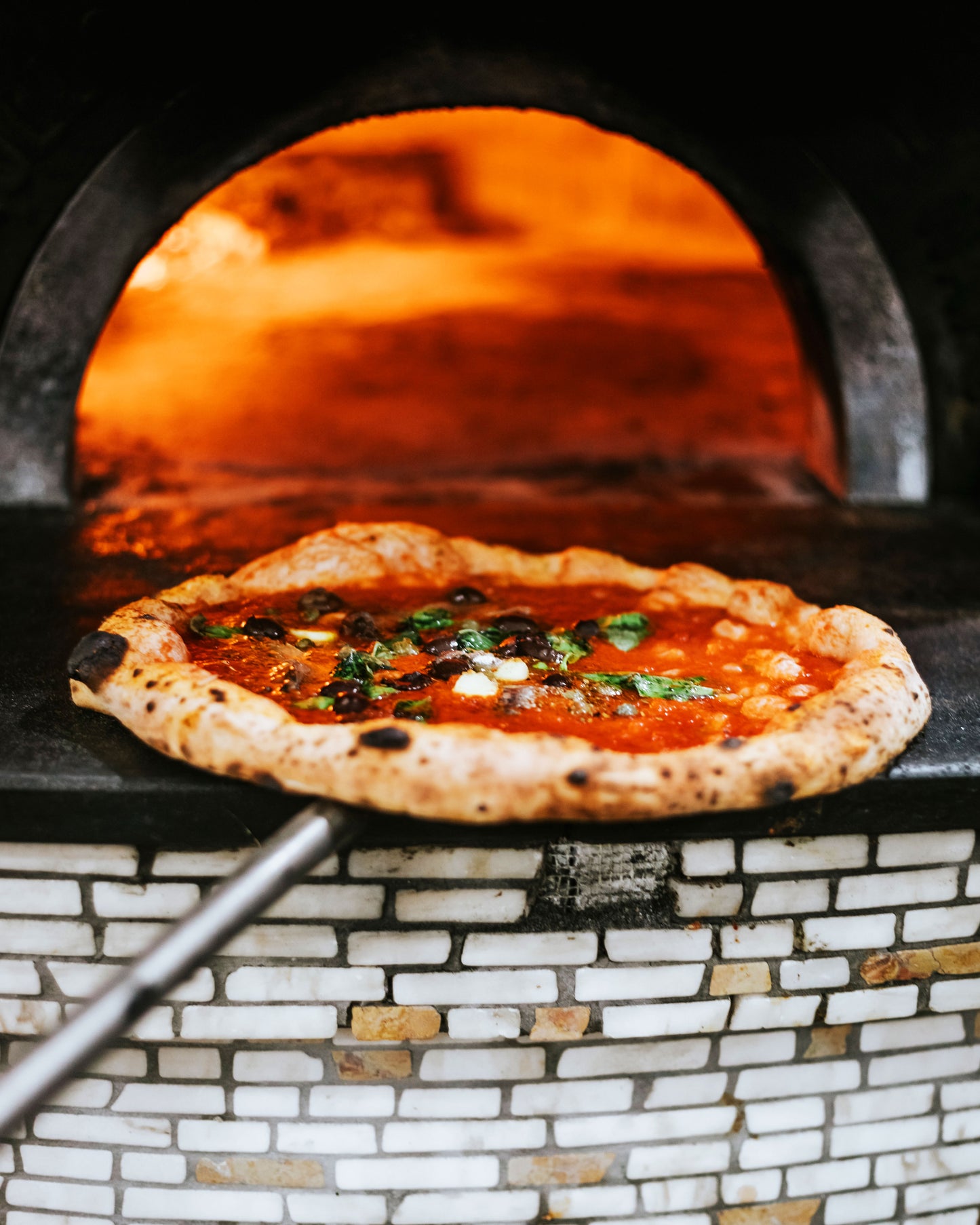 Detail of a pizza fresh out of the oven.