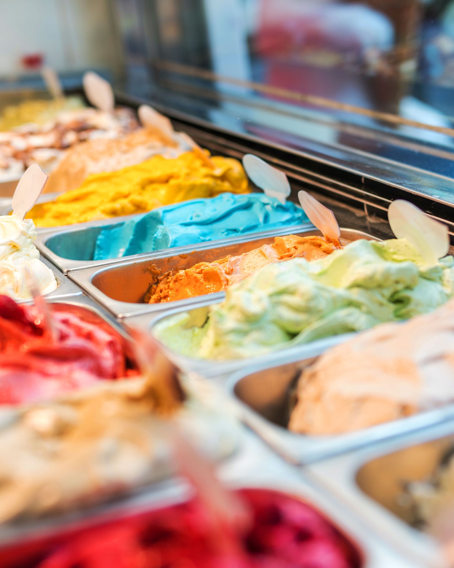 Rows of ice cream flavors at an ice cream shop.