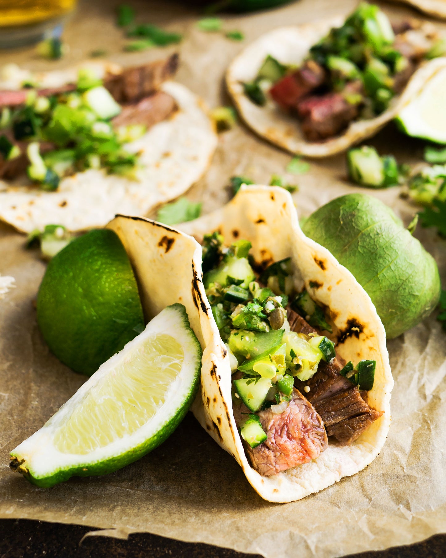 Tacos served with lime on the side.