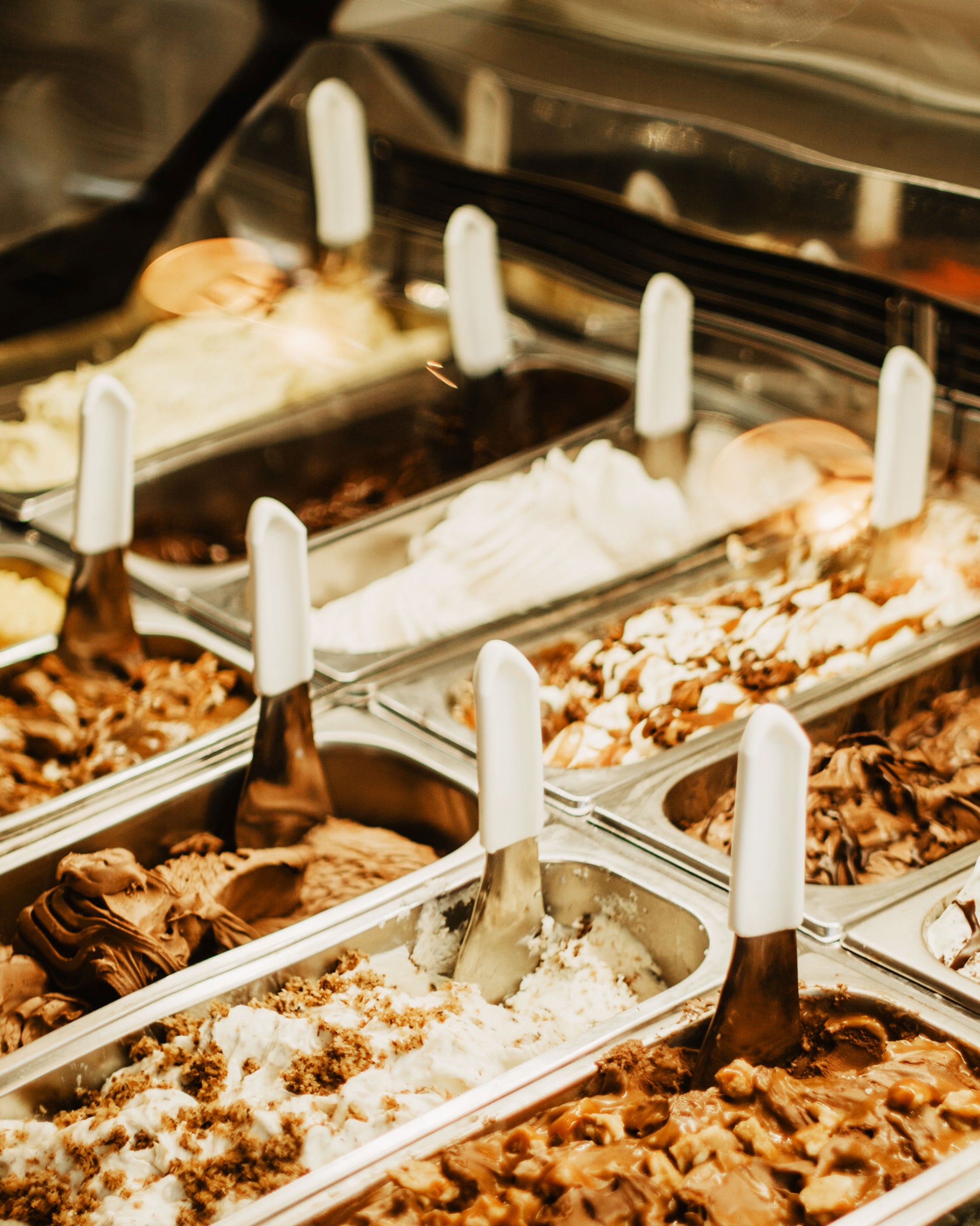 Rows of ice cream flavors at an ice cream shop.