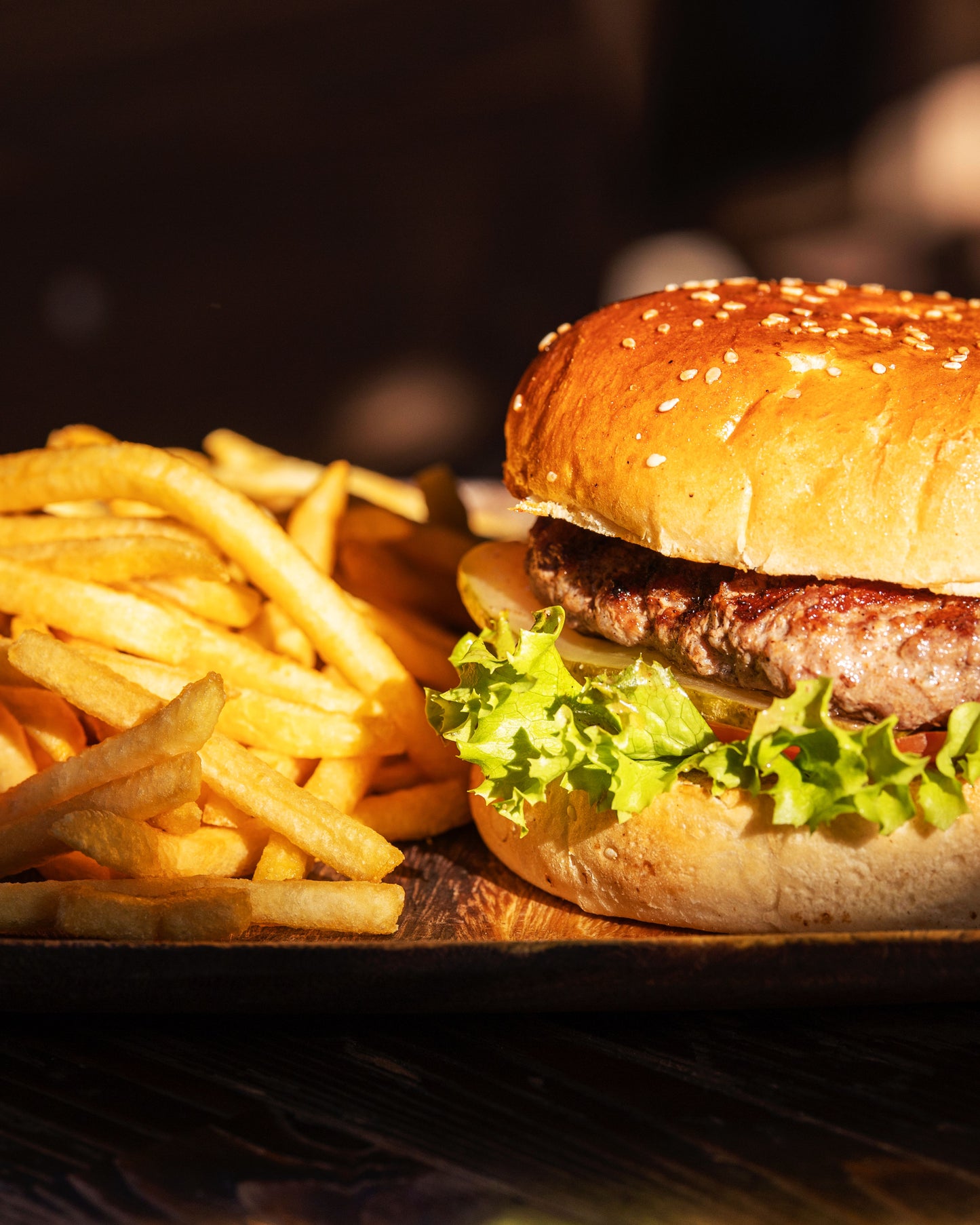 Detail of a restaurant's burger and fries.