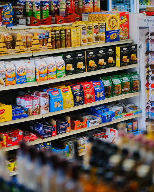 Snacks on shelves in a convenience store.