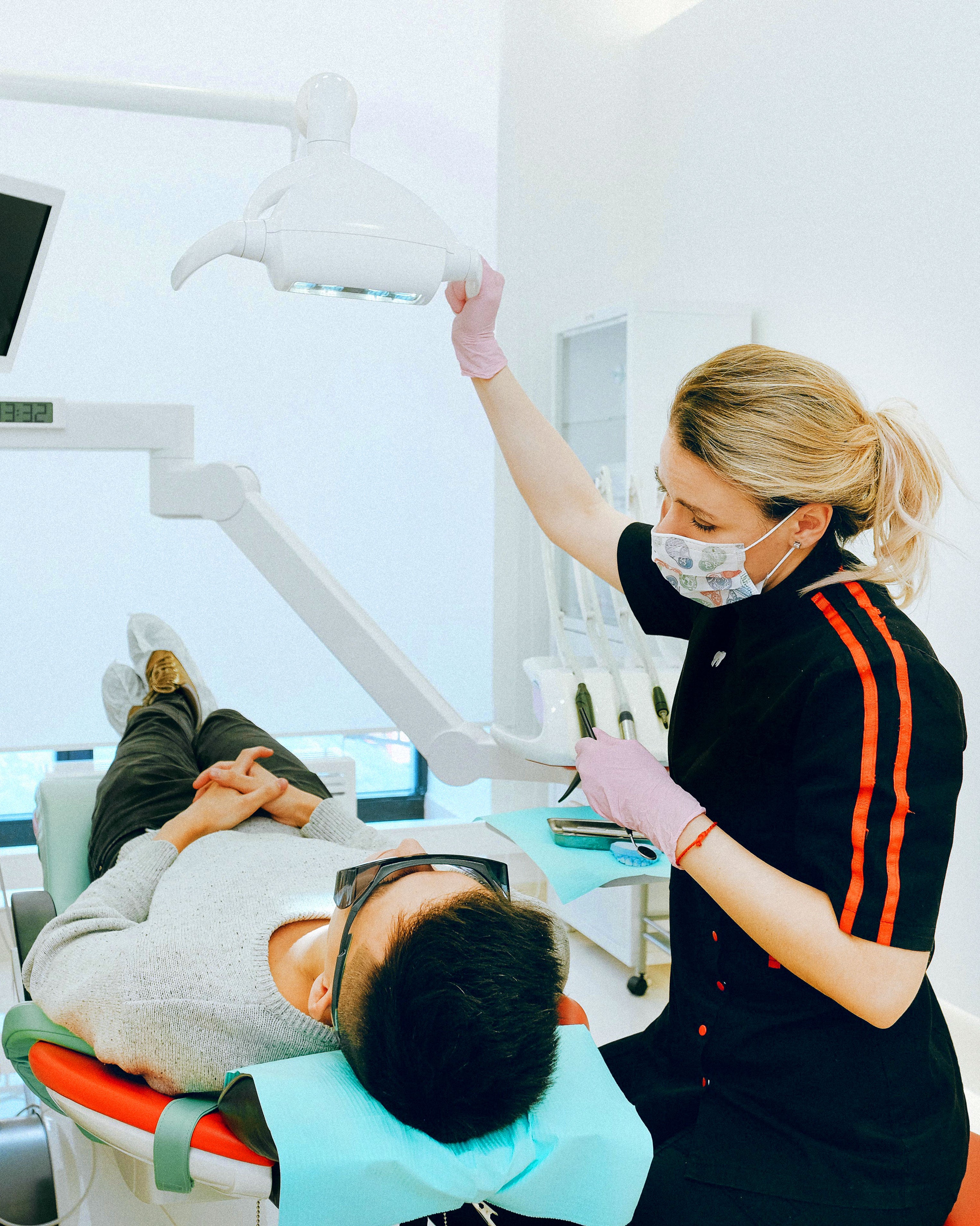 A dentist checking up on a patient.