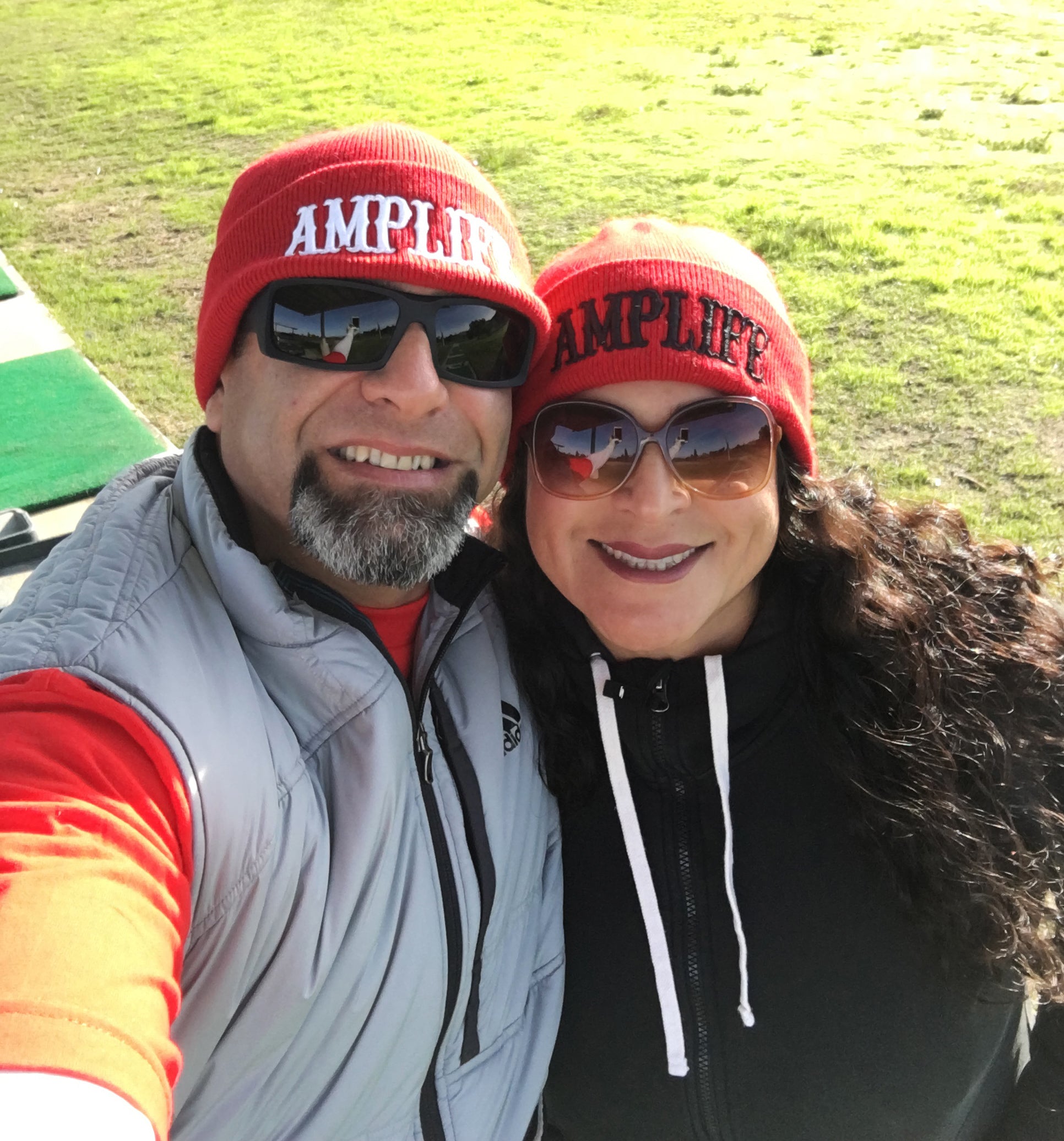 Priscilla and Abdul Nevarez selfie wearing Amplife Beanies.