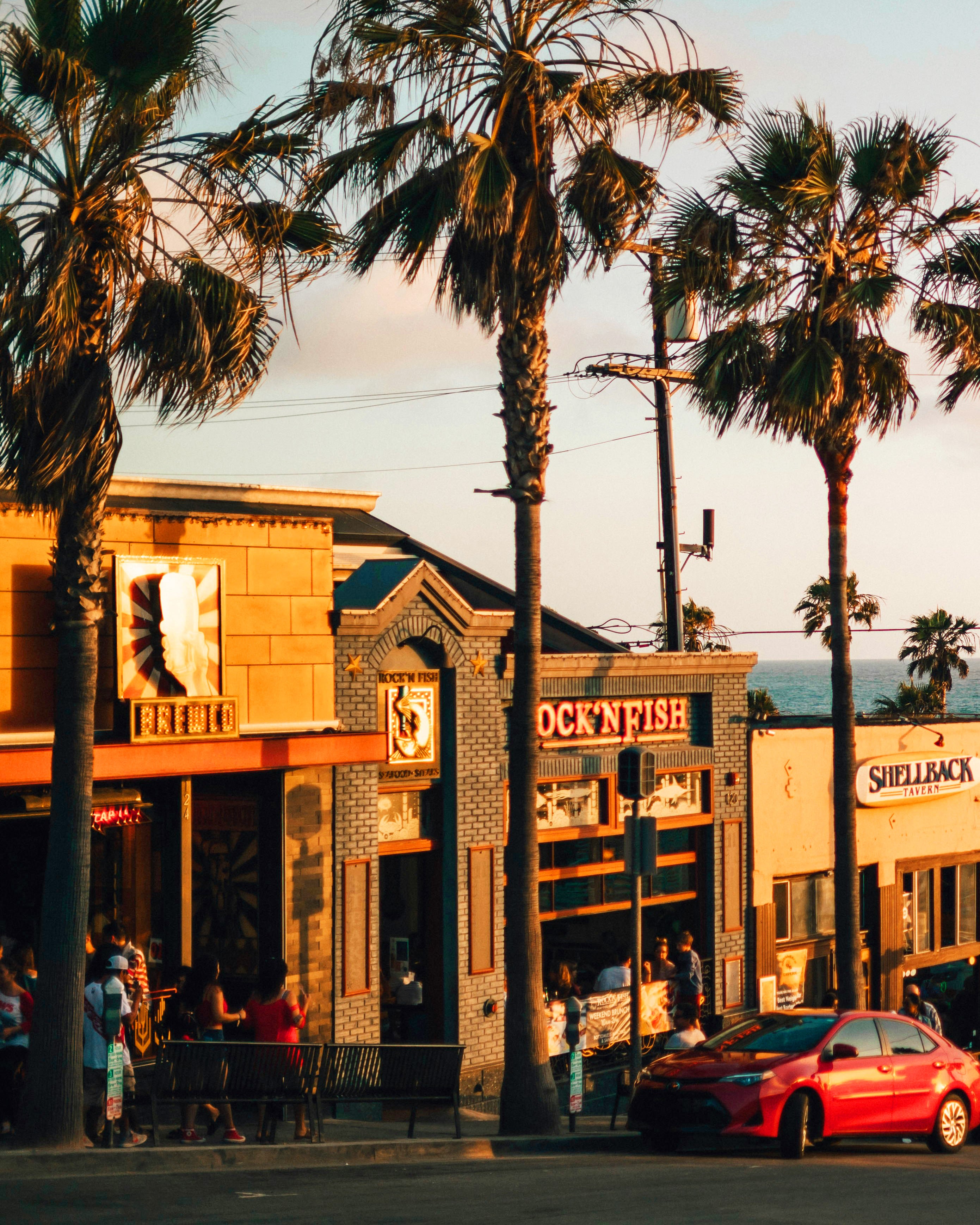 California beach restaurant businesses at sunset.