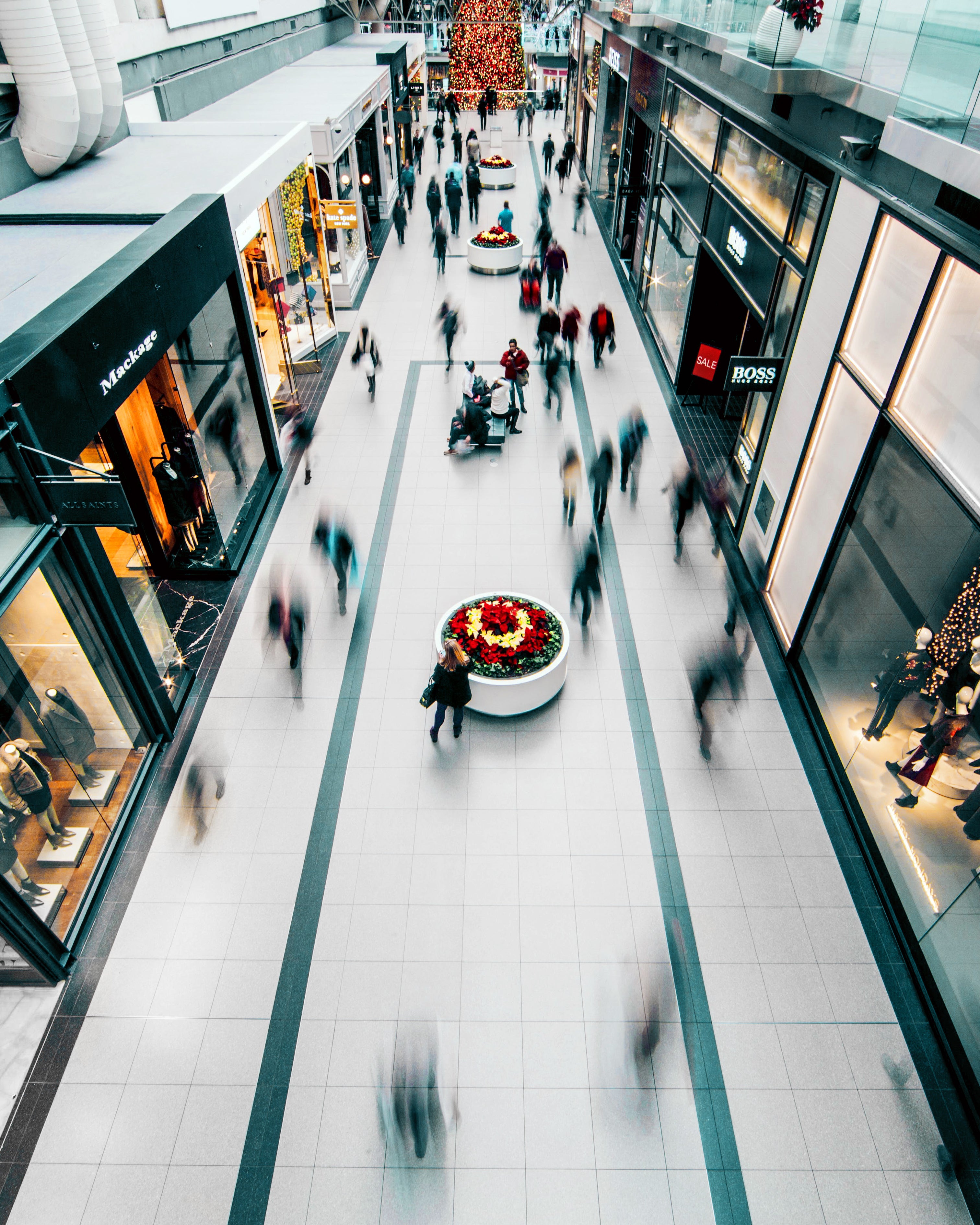 People walking through mall.